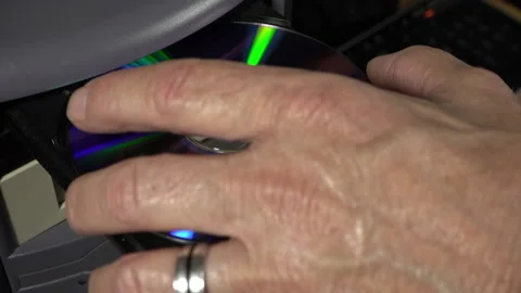 Inserting and ejecting a computer DVD disk Stock Footage 218271336