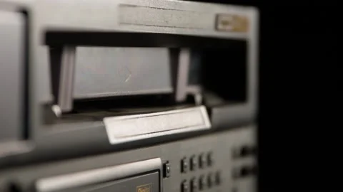 Inserting and Ejecting a Videocassette from a Broadcast Video Recorder 動画素材 135011859