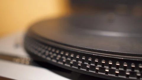 Inserting and ejecting of vinyl disc on a record player closeup view Stock Footage 111440952