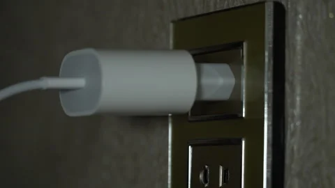 Inserting and removing the plug from the socket Stock Footage 255449546