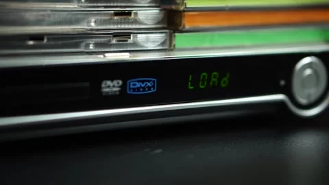 Inserting and Starting Playback of Mini DVD Video Disk in Player, Close Up Stock Footage 296789905