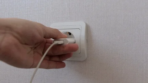 Inserting the appliance into the socket Stock Footage 89094244