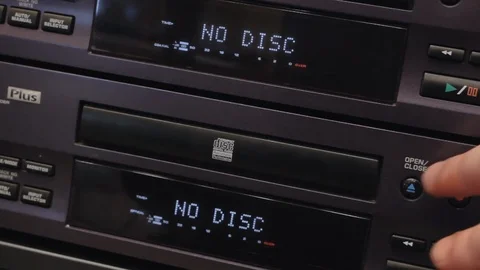 Inserting a blank cd disk into the cd recorder Stock Footage 108543299