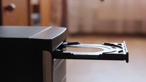 Inserting a blank CD or DVD into a laptop computer Stock Footage 86360252