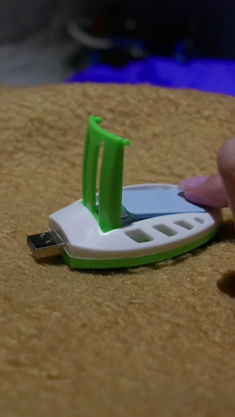 Inserting Blue Insecticide Mat Into Portable Usb Mosquito Repeller Stock Footage 345172886