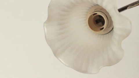 Inserting a bulb. In the glass chandelier. Video stock 55714641