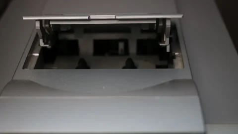 Inserting The Cassette into cassette player Stock Footage 163040472