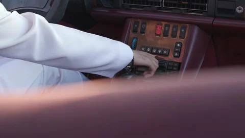 Inserting a cassette inside a car player  recorder for an old Mercedes 4K 動画素材 162024828