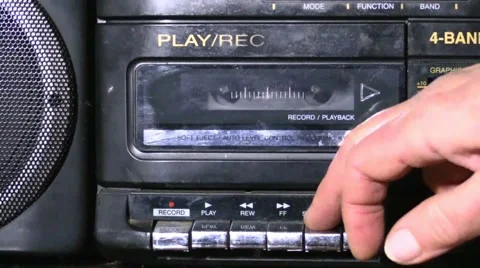 Inserting cassette in the tape recorder Stock Footage 56704882