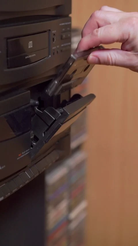 Inserting a cassette into tape recorder Stock Footage 331455801