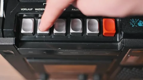 Inserting Cassette Tape: Smooth Retro Action Stock Footage 303865167