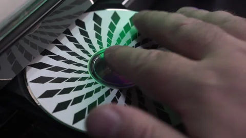 Inserting CD in Compact Disc Player, Playing Music in Old Audio System Stockbeeldmateriaal 325497625