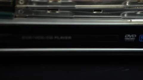Inserting CD in DVD Media Player, Close Up Dolly Shot Stock Footage 297048654