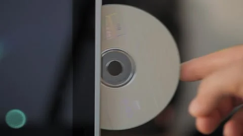 Inserting cd on PC and ejecting Stock Footage 54541130