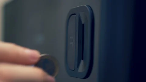 Inserting coin into a vending machine and pressing return coin button Stock Footage 112153352