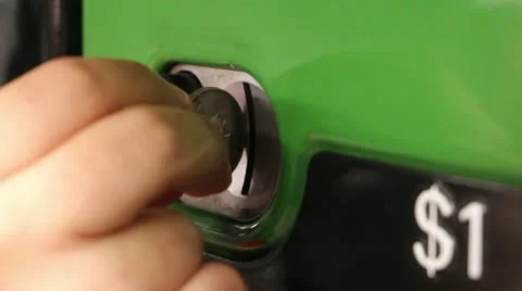 Inserting coins Stock Footage 11874261