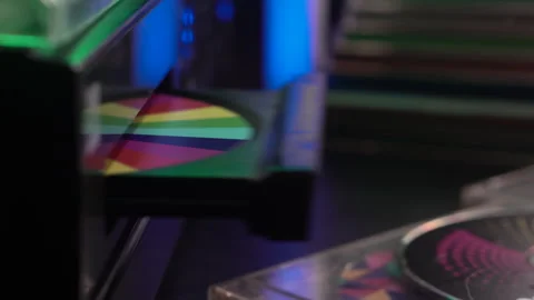Inserting Compact Disc in CD Player, Close Up Stockbeeldmateriaal 325499161