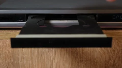 Inserting a disc into the DVD player Stock Footage 265013964
