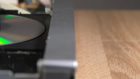 Inserting a disc into the DVD player, starting the DVD player Stock Footage 265014429
