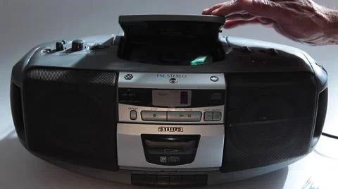 Inserting A Disc Into A Ghettoblaster - CD Player Video stock 44354110