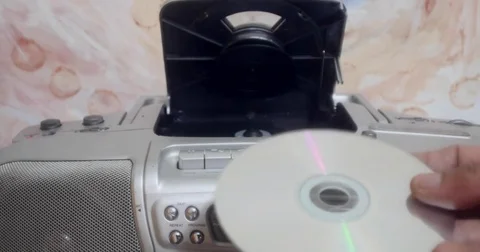 Inserting A Disc Into A Ghettoblaster - Cd Player 動画素材 76946667