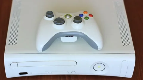 Inserting disc into home video game console Stock Footage 64798255