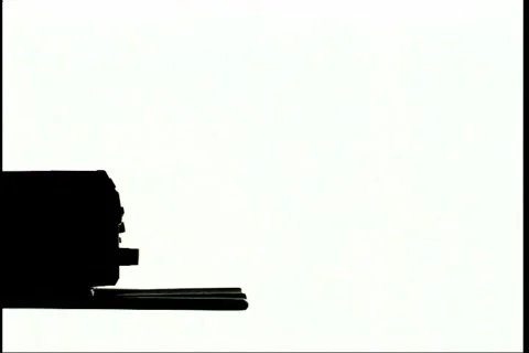 Inserting DVD, silhouette Stock Footage 298593