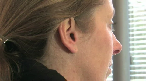 Inserting ear plugs Stock Footage 549114