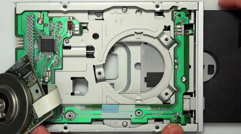 Inserting floppy disk into opened disk drive 03 Stock Footage 59862357