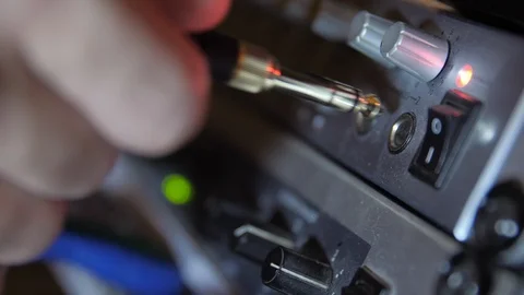 Inserting a headphone jack, audio interface Stock Footage 90779171