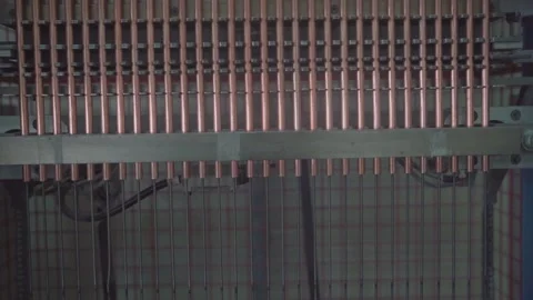 Inserting Heating Wire into Copper Tubes - Heat Exchanger Factory Production Video stock 330493577