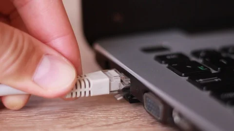 Inserting internet cable to notebook 스톡 동영상 88764169