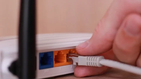 Inserting internet cable to router Stock-Footage 88764100