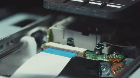 Inserting medium and reading DVD disc in players mechanism rotating fast Stock Footage 58425578