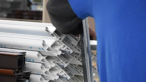 Inserting metal bars in PVC windows and doors sections Stock Footage 75575090