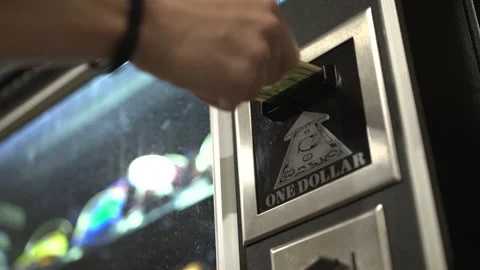 Inserting one dollar bill into vending machine for snack 4k Video stock 148068552