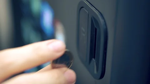 Inserting one euro coin into vending machine Stock Footage 112150957