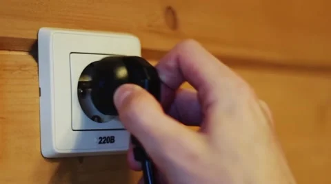 Inserting the plug into the socket Stock Footage 48049972