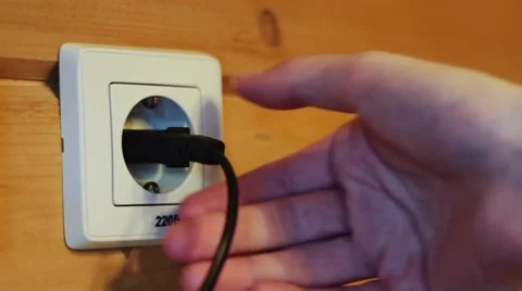 Inserting the plug into the socket Stock Footage 48050414