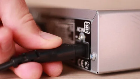 Inserting power cable into electronic device 動画素材 88245042