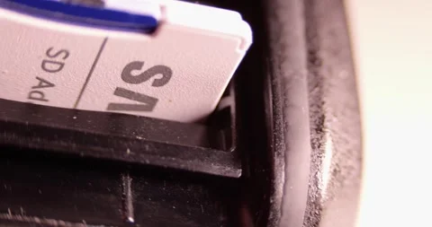 Inserting Removing SD Memory Card Digital Device Slot Data Storage Transfer Stock Footage 321809042