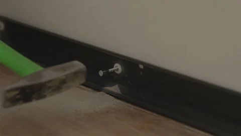 Inserting screw into plastic wall dowel plug in wall 스톡 동영상 346159809