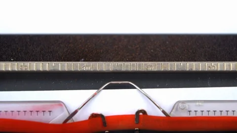 Inserting a sheet of paper into a typewriter, close up Stock Footage 129535254