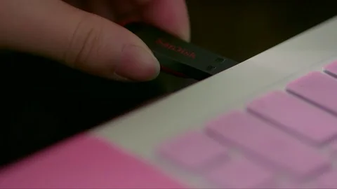 Inserting a USB flash drive into a laptop Stock Footage 261641929