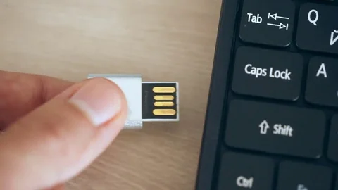 Inserting usb flash memory card into portable computer Stock Footage 81328937
