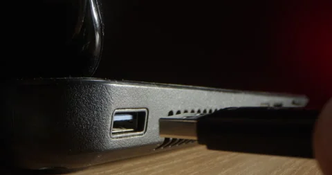 Inserting a USB Stick inside a Computer to Hack it on a Black and Red Stock Footage 158562955