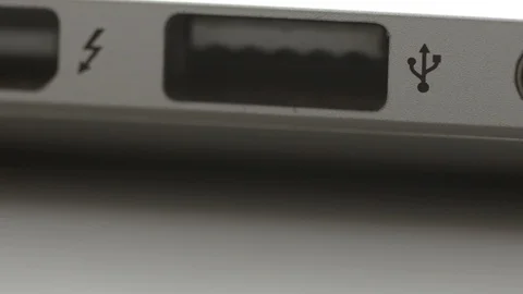 Inserting USB stick  into the USB port of a laptop Stock Footage 92525201