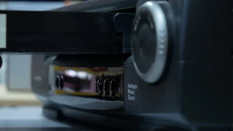 Inserting a VHS Tape into a VCR Player Stock Footage 101365357