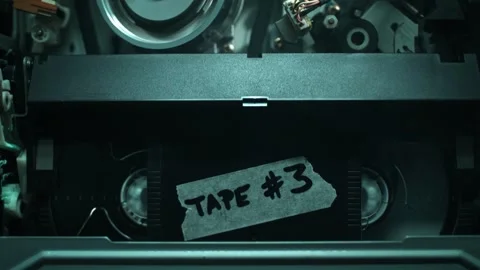 Inserting VHS Tape - Video Cassette Being Pushed into the VCR Stock Footage 278830718