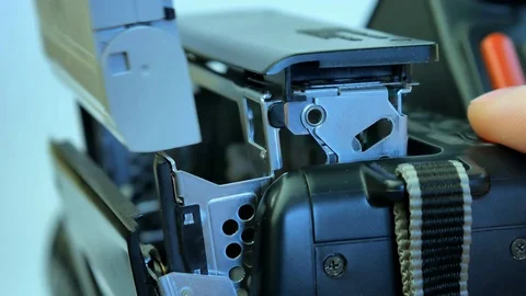 Inserting the video cassette into 8mm camera Stock Footage 72222291